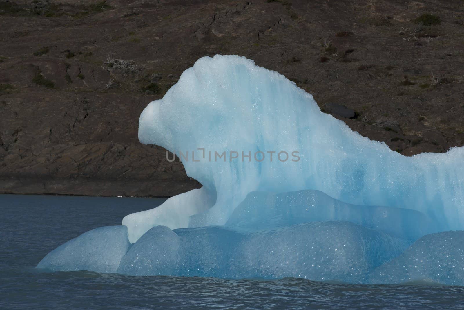 Spectacular blue iceberg floating on the Lake Argentino in the Los Glaciares National Park, Patagonia, Argentina.