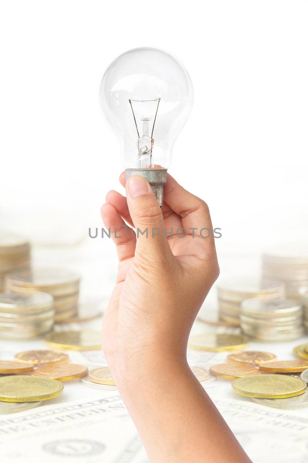 light blub in hand,save money concept







light blub in hand with money background