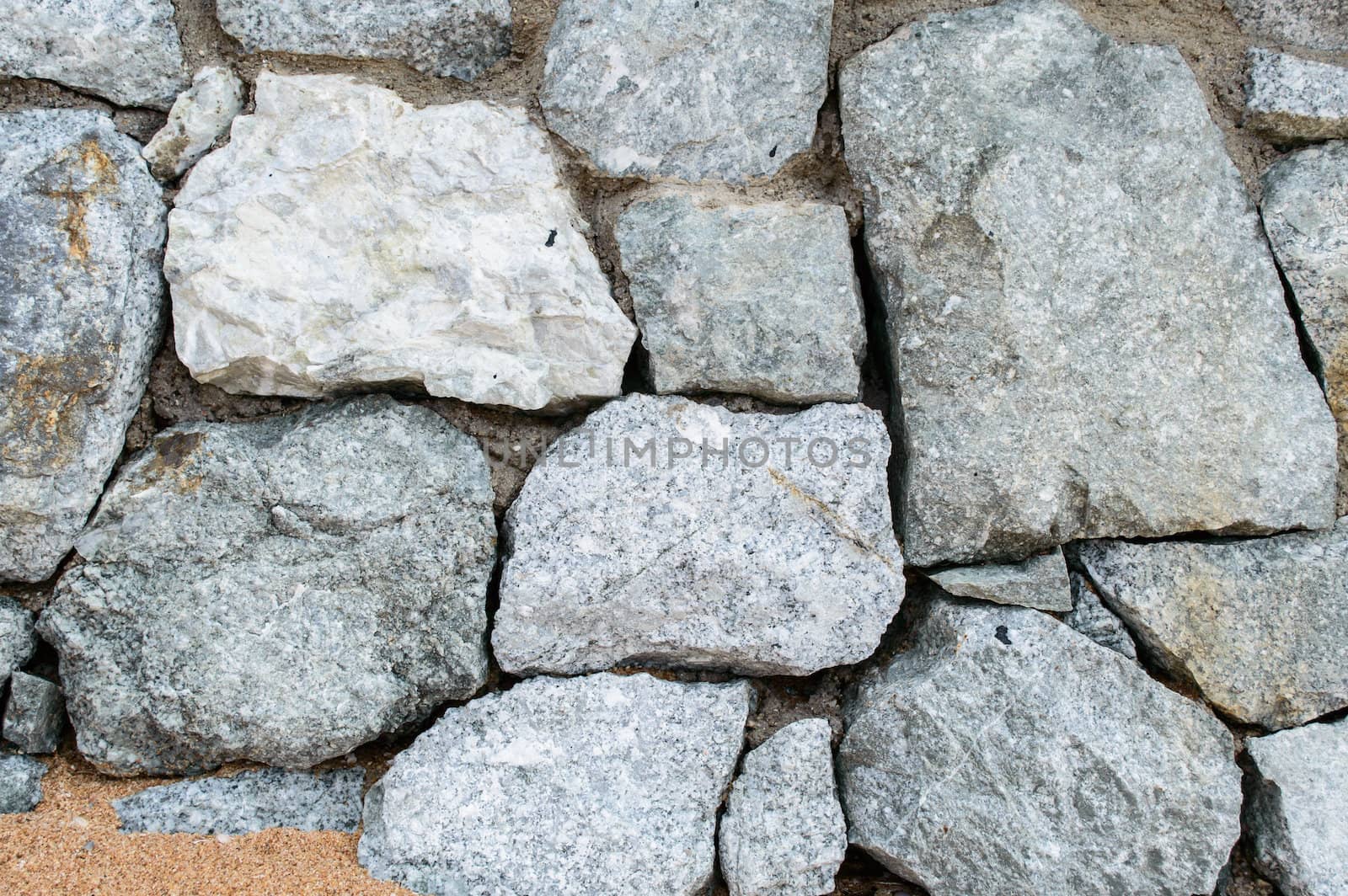 Solid stone wall along the sea beach, Pattaya.