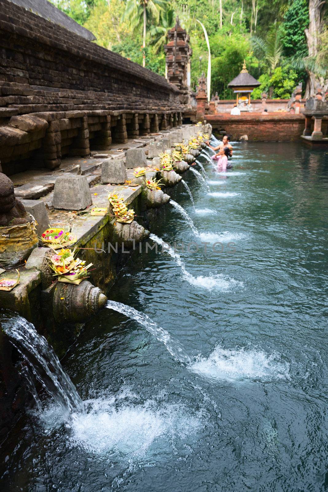 Holy spring water in Tirta Empul temple, Bali, Indonesia 
