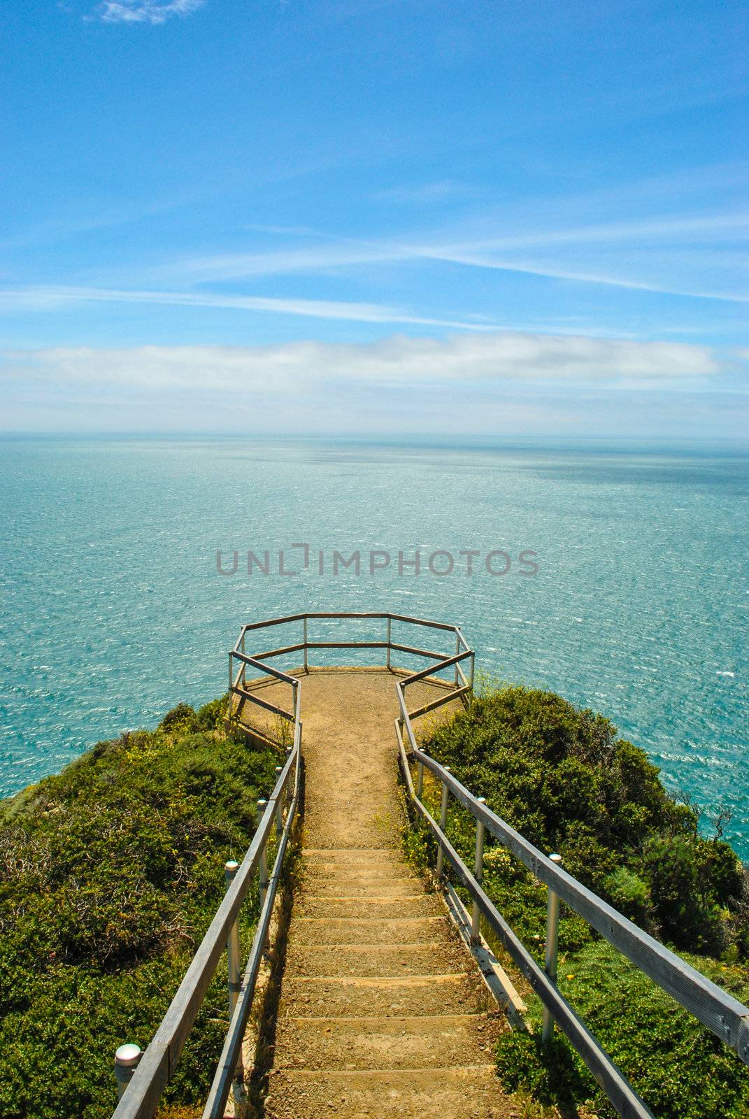 Photograph of a walkway leading to overlook on the California Coast overlooking the Pacific Ocean.