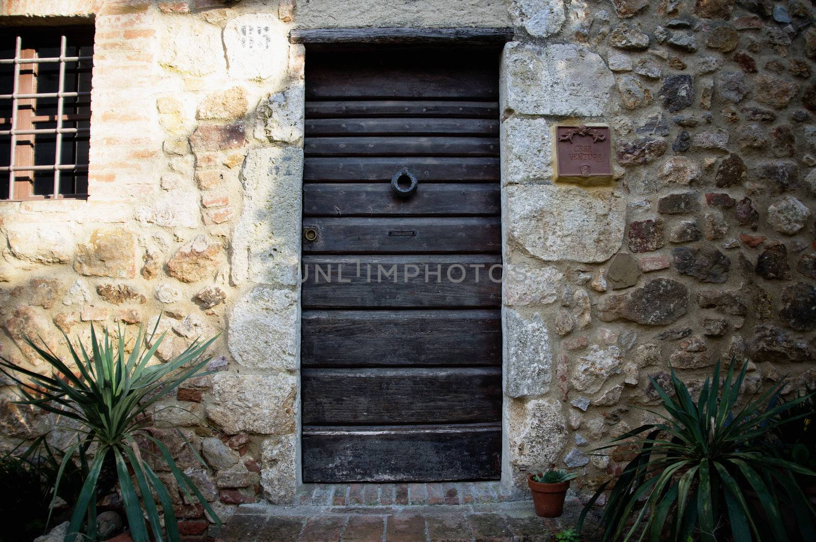 Wooden door at the ancient Tuscany Castle