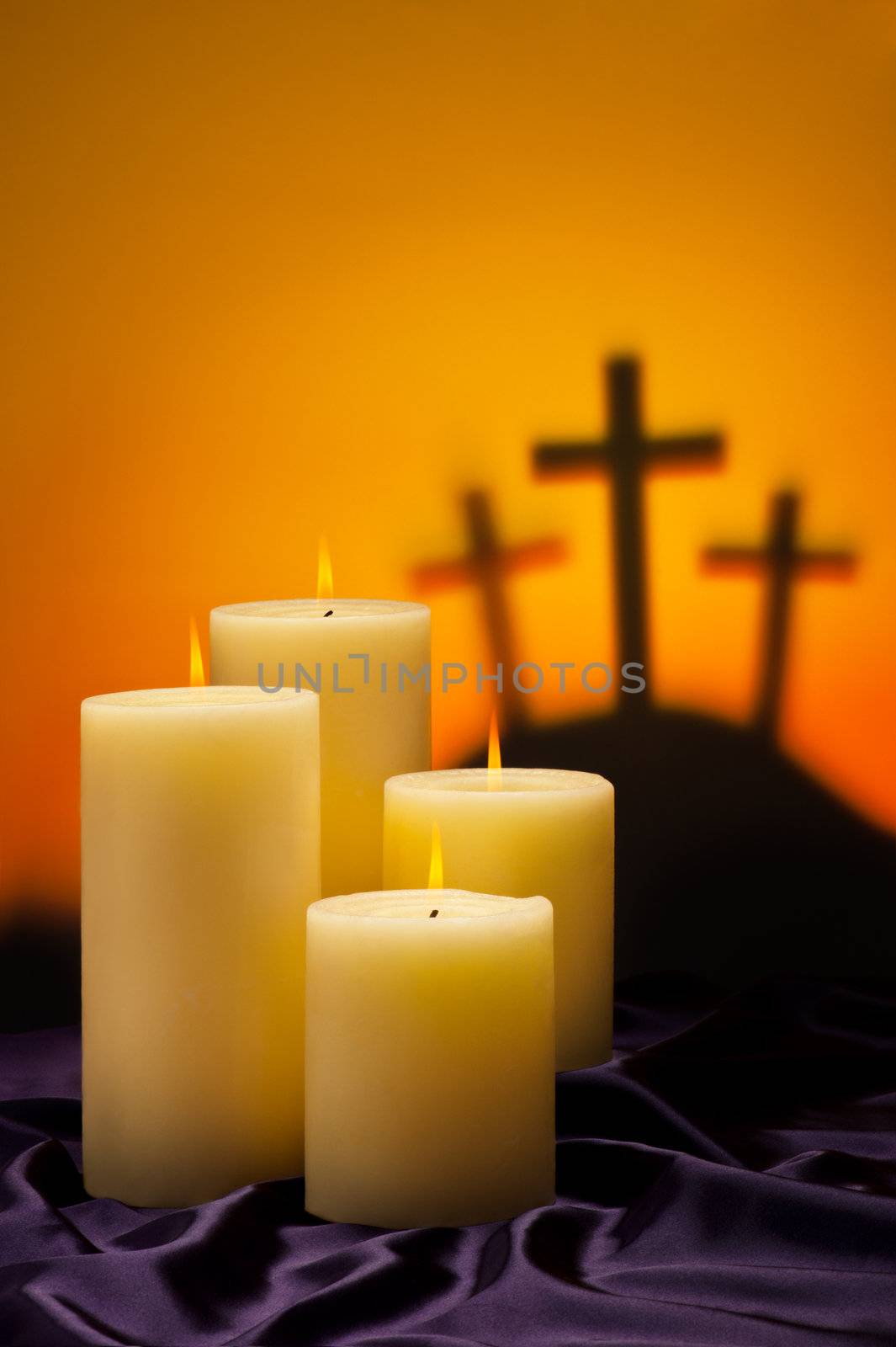 Three crosses symbolic for Jesus crucifixion in Golgotha and candles of hope