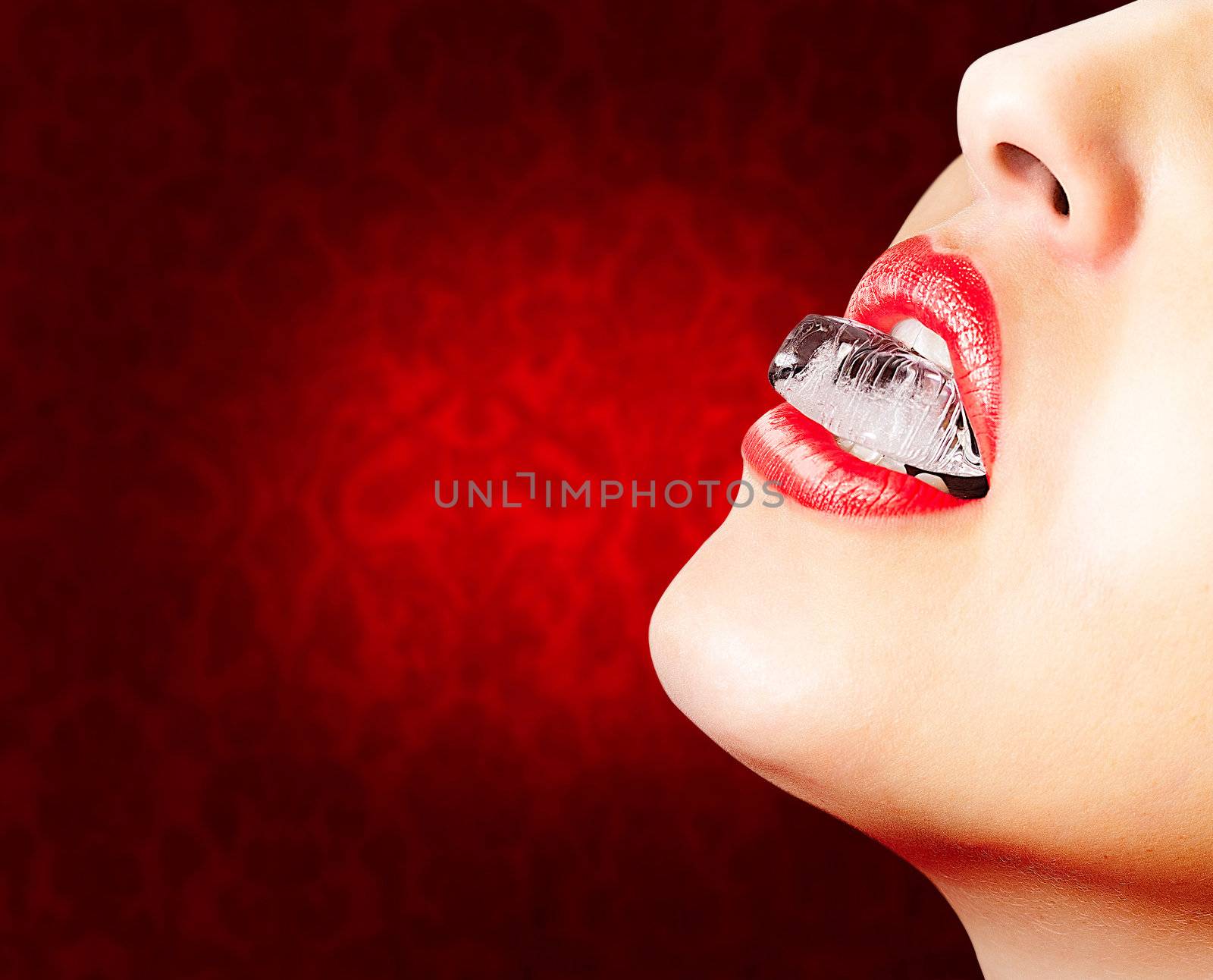 Closeup of red lips whit an ice cube  by doble.d