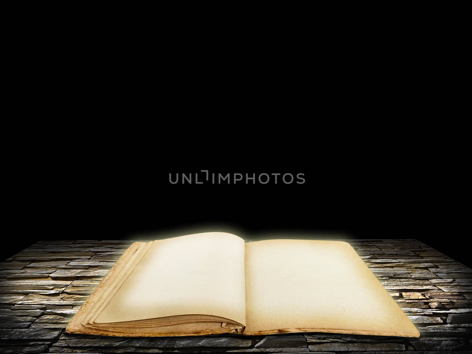 Old open book with blank pages on stone grunge background