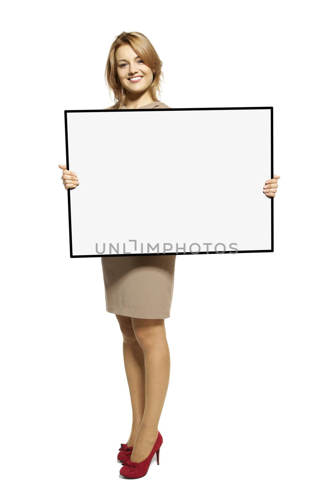 Attractive Young Woman Holding Up a Blank Sign. Studio shot of woman isolated on white background.