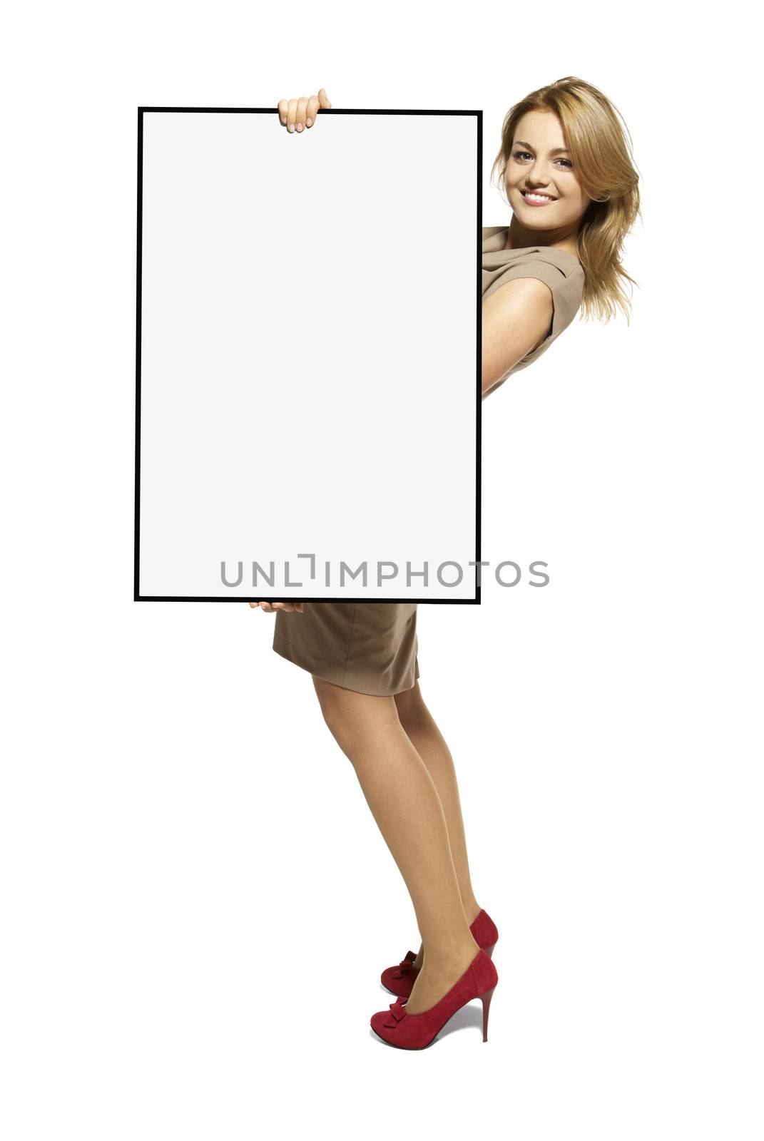 Attractive Young Woman Holding Up a Blank Sign. Studio shot of woman isolated on white background.