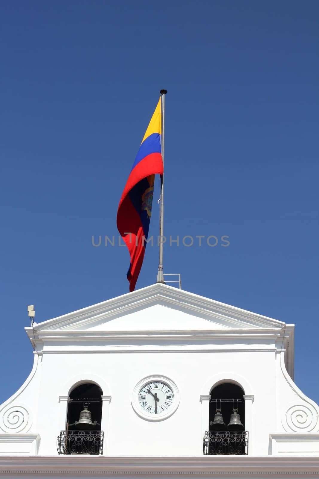 Government building and waving flag of Ecuador in Quito, Ecuador
