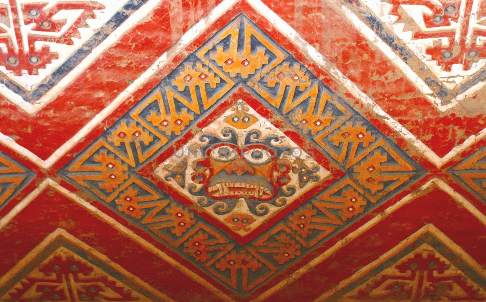 Painted religious figure on adobe wall in Huaca de la Luna archaeological site in the Moche valley, Peru
