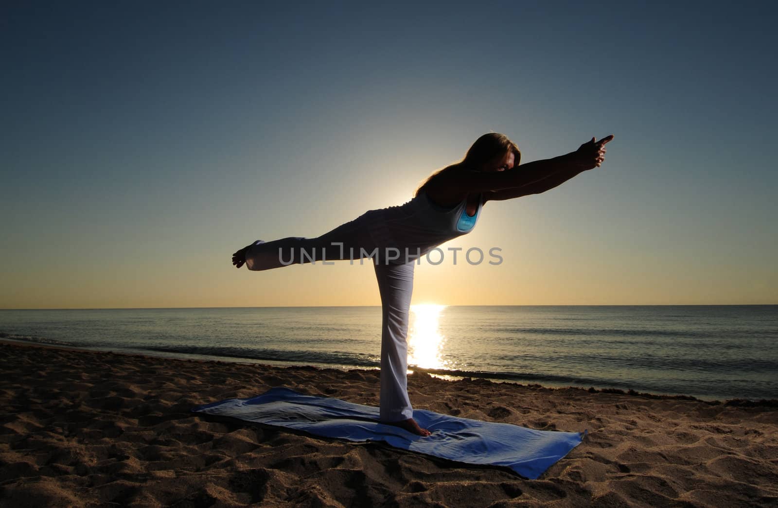 Warrior III yoga pose on beach by ftlaudgirl
