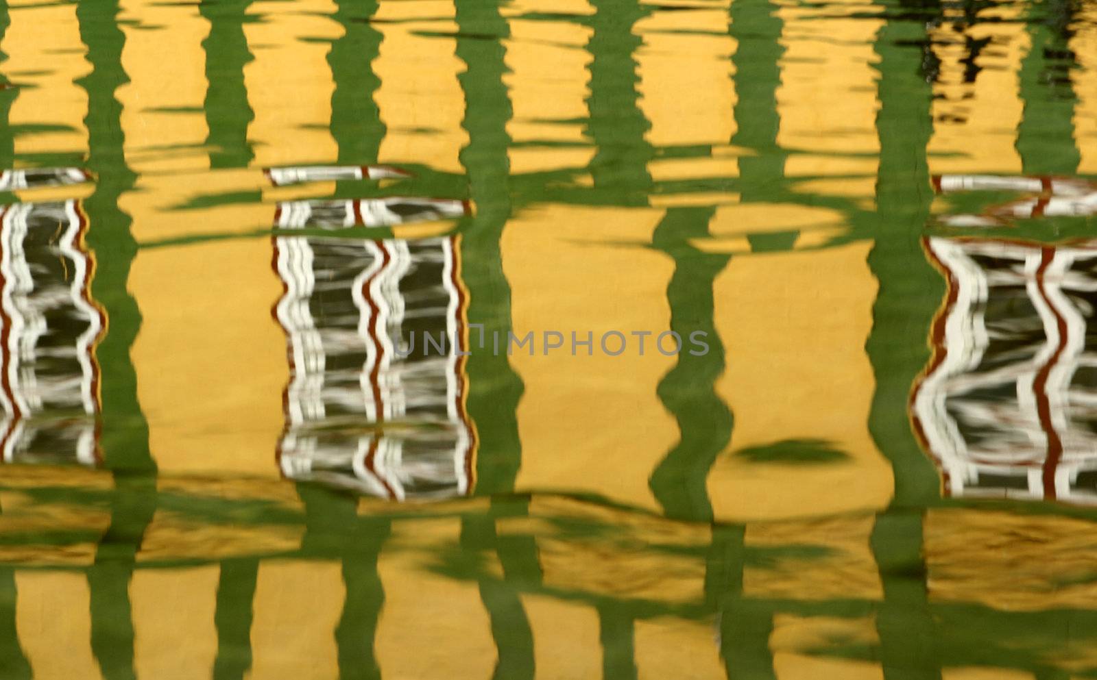 reflection in the water in the street of a danish village in grenaa in the summer(half timbered house)