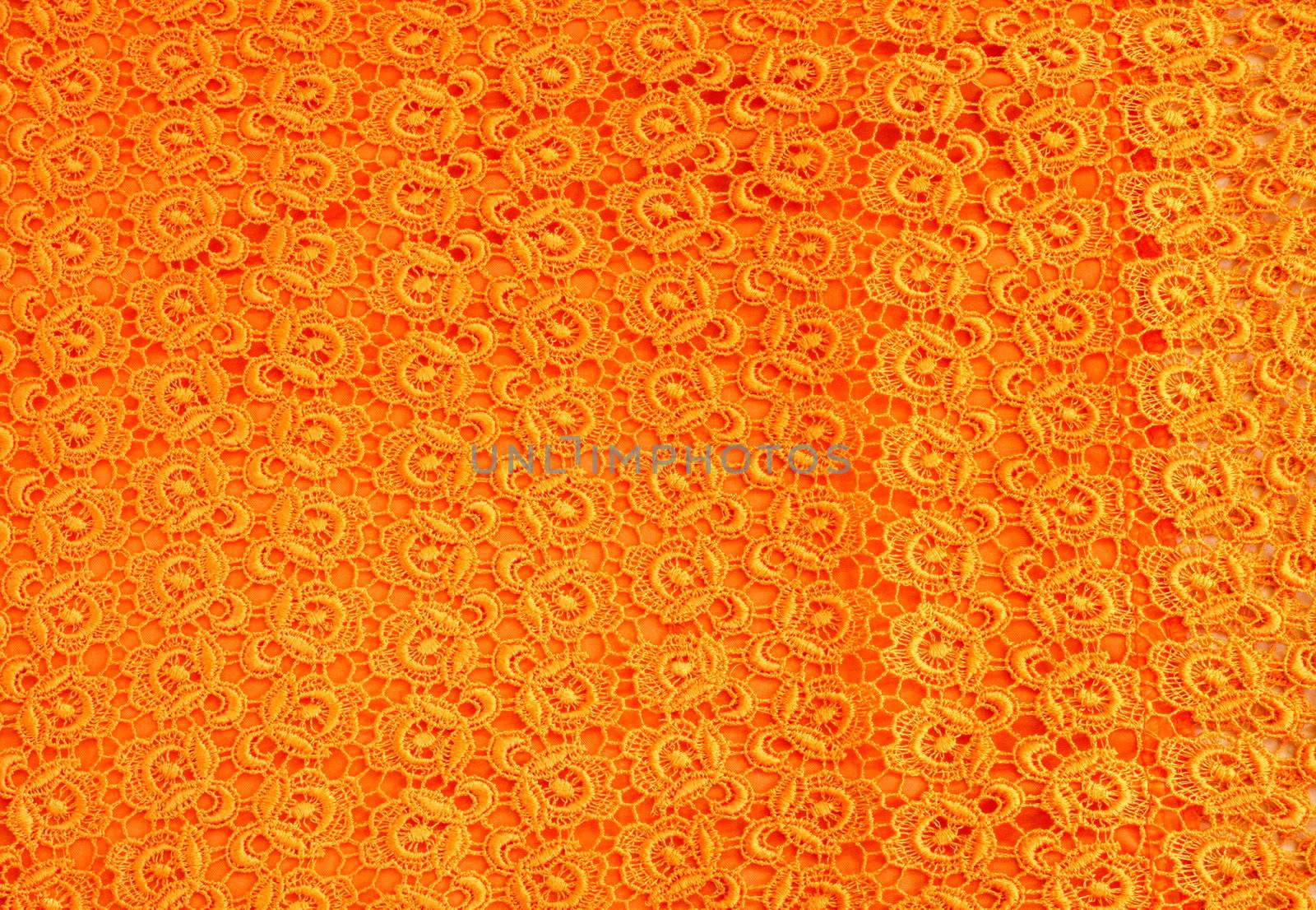 Detail of orange lace pattern fabric  by nuchylee