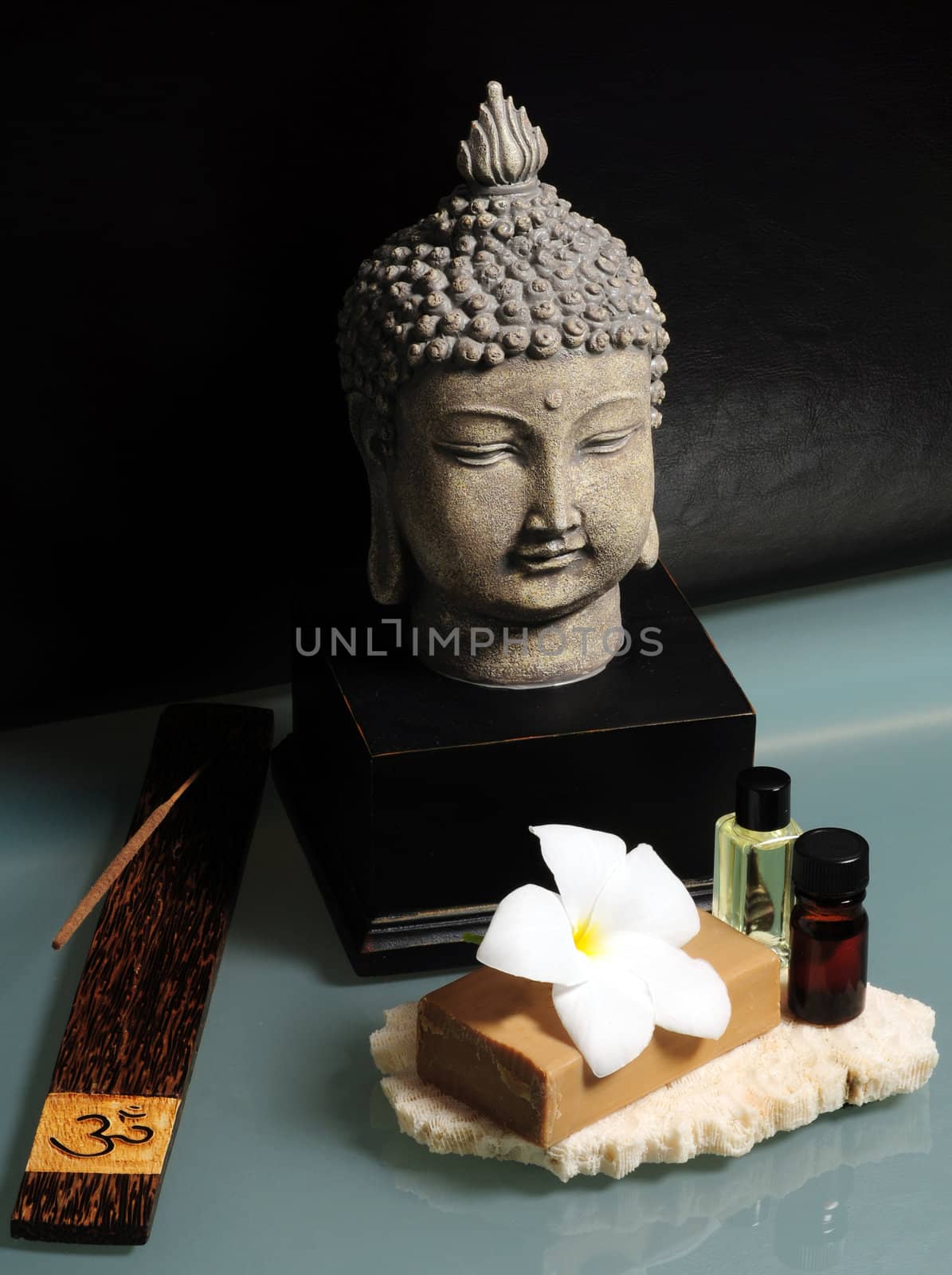An asian spa experience with essential oils, Buddha and incense