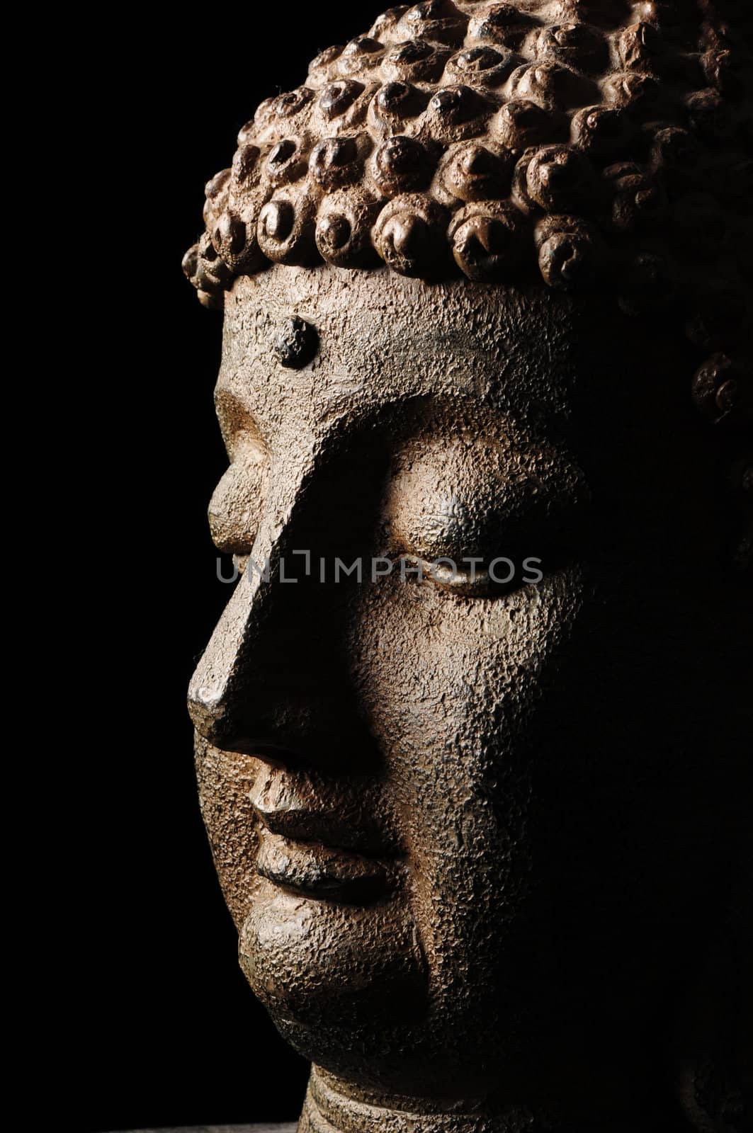 Buddha head isolated on black