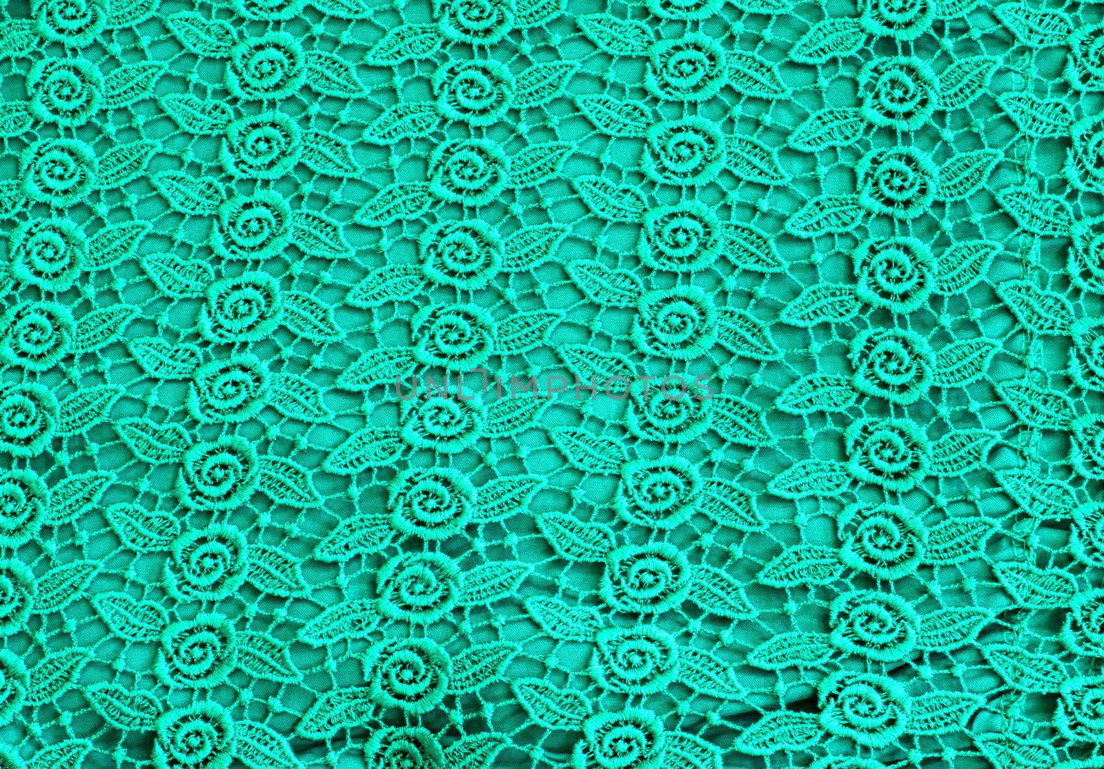 Detail of green lace pattern fabric  by nuchylee