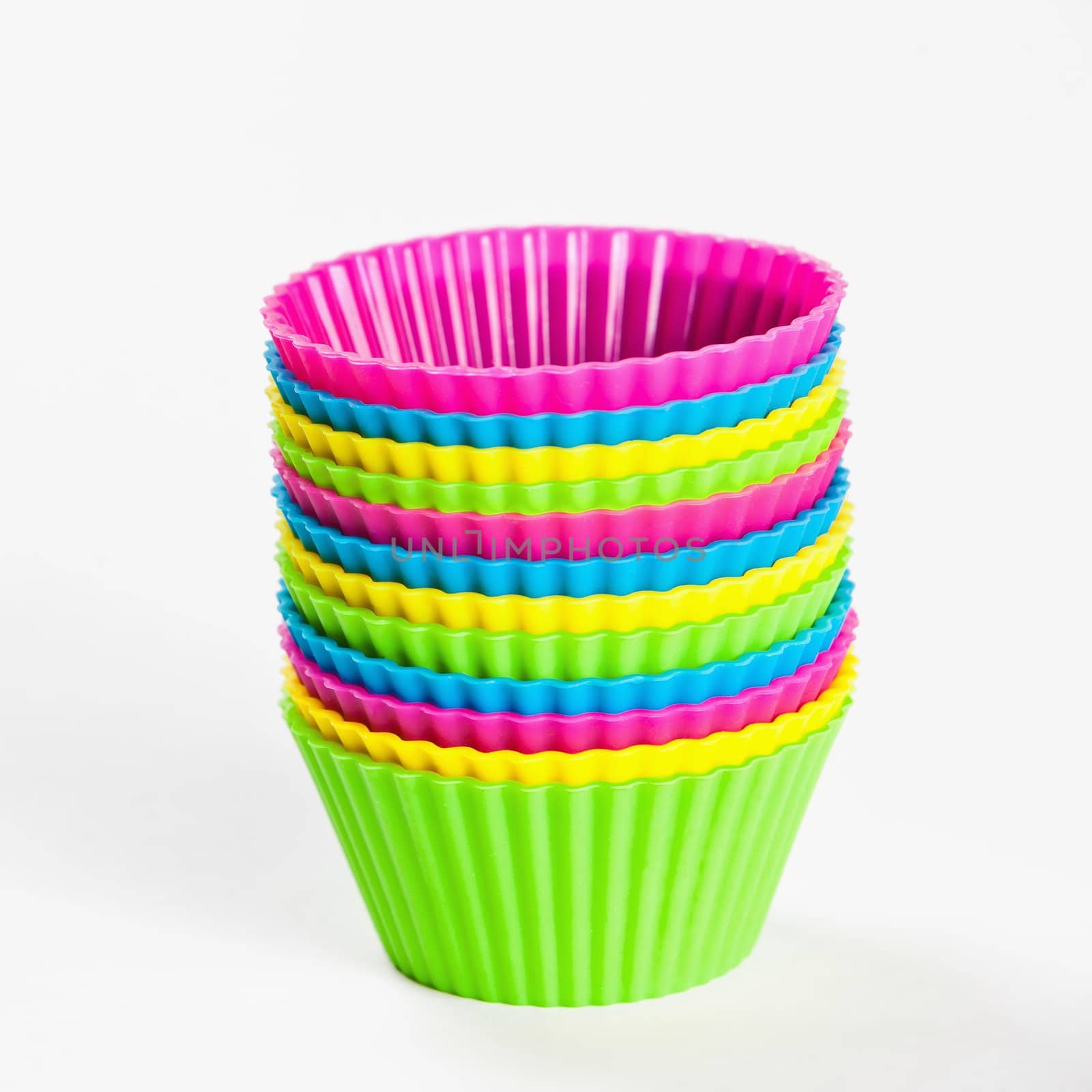 baking silicone cups for cupcakes or muffins on white background