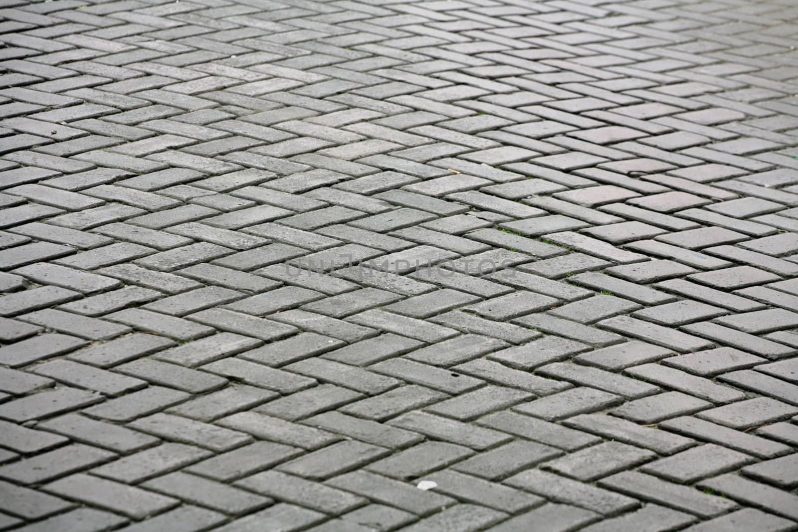 stones pavement  in a street un amsterdam Holland
