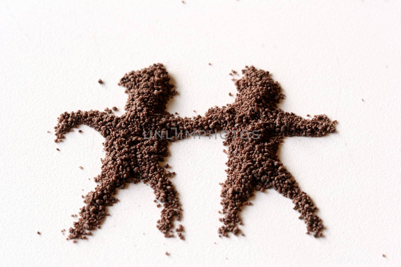 small  figures of man made in chocolate powder
