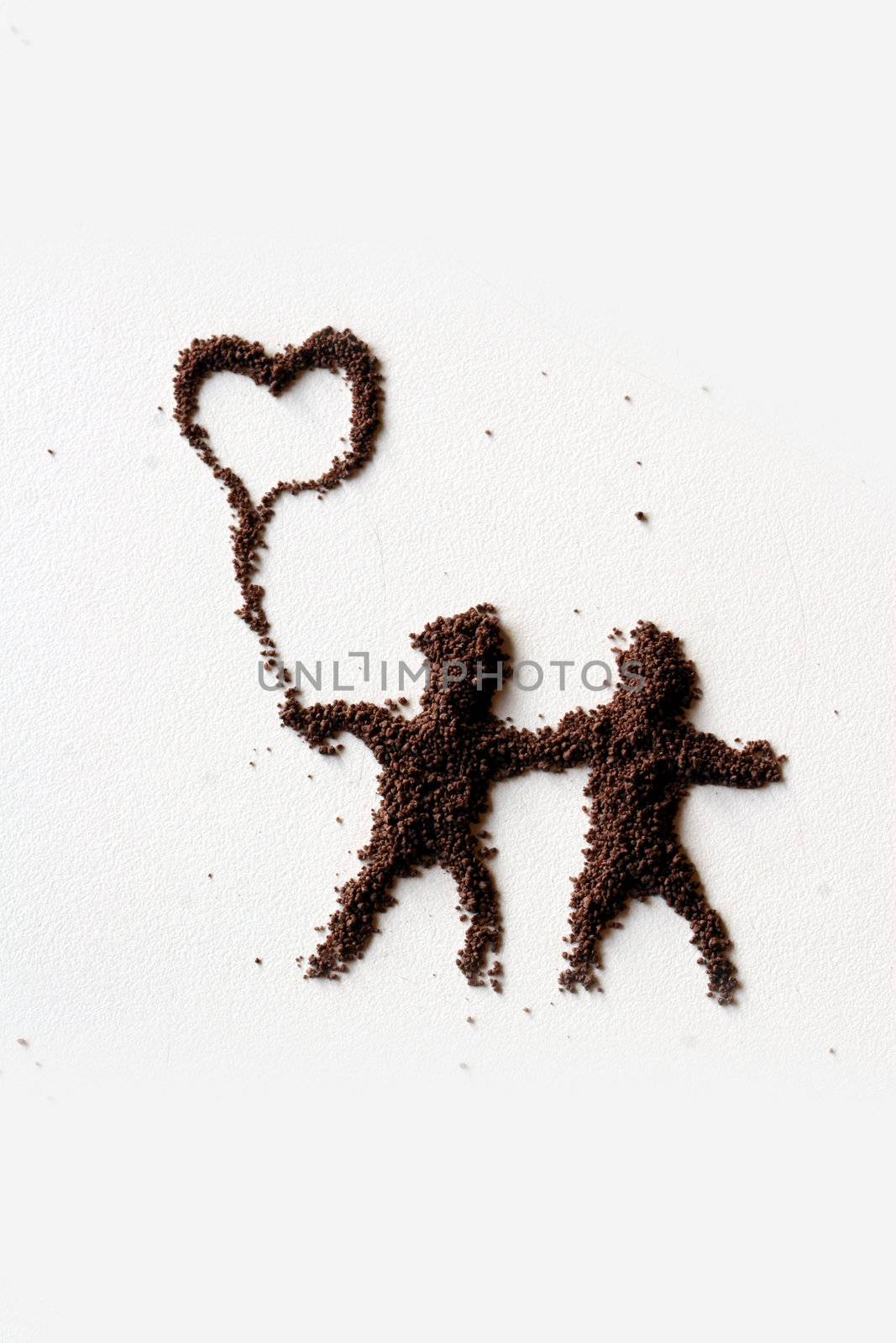 small  figures of man made in chocolate powder