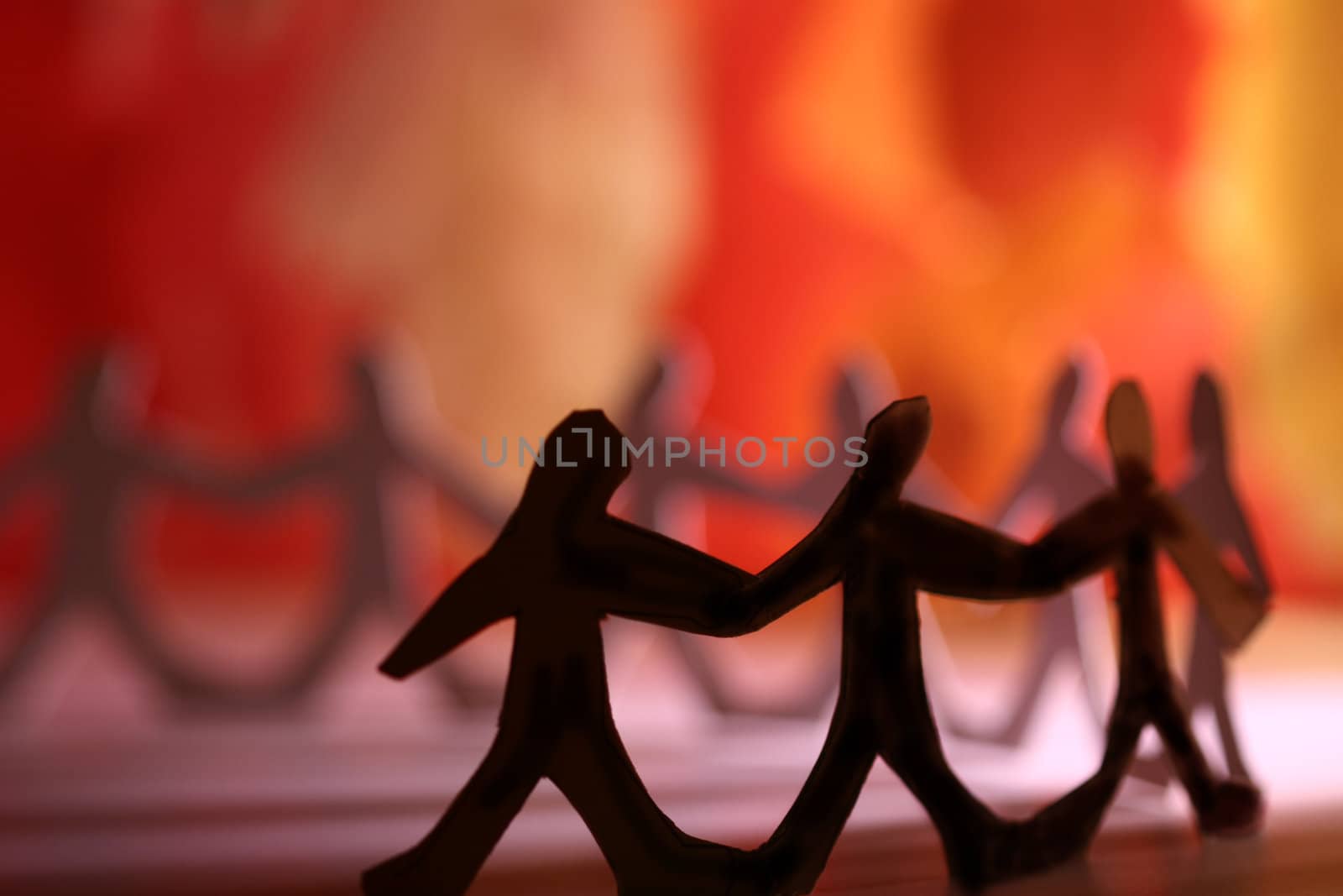 small rudimentary figures of man in paper