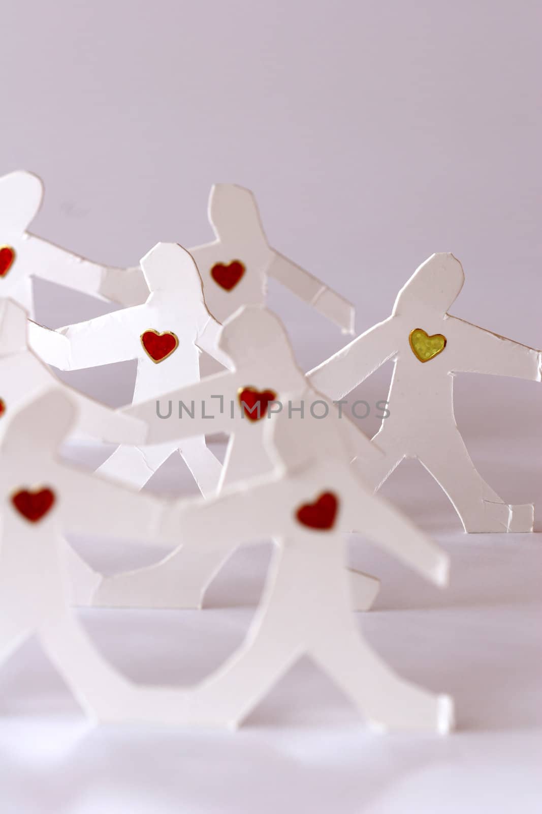 small rudimentary figures of man in paper