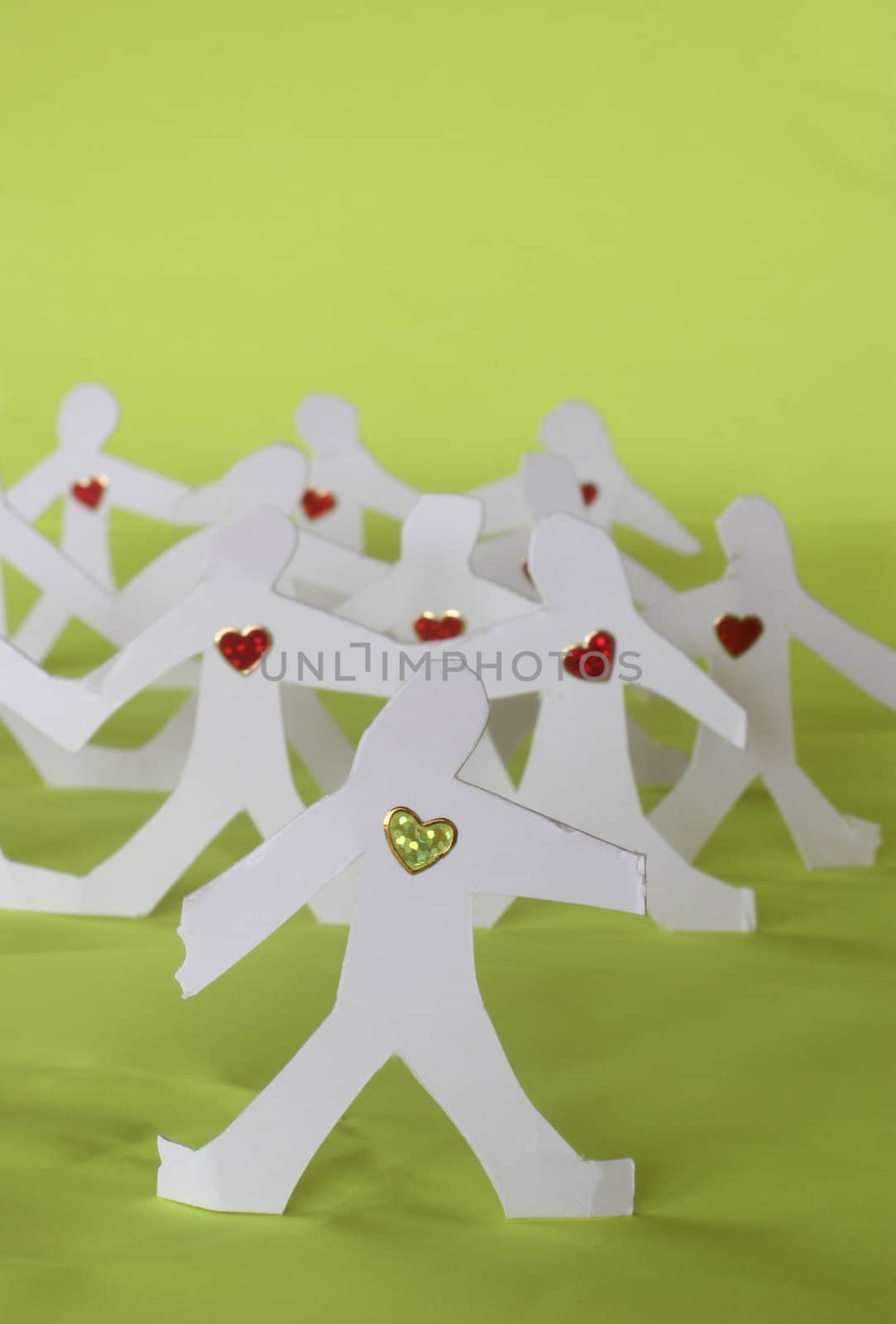small rudimentary figures of man in paper