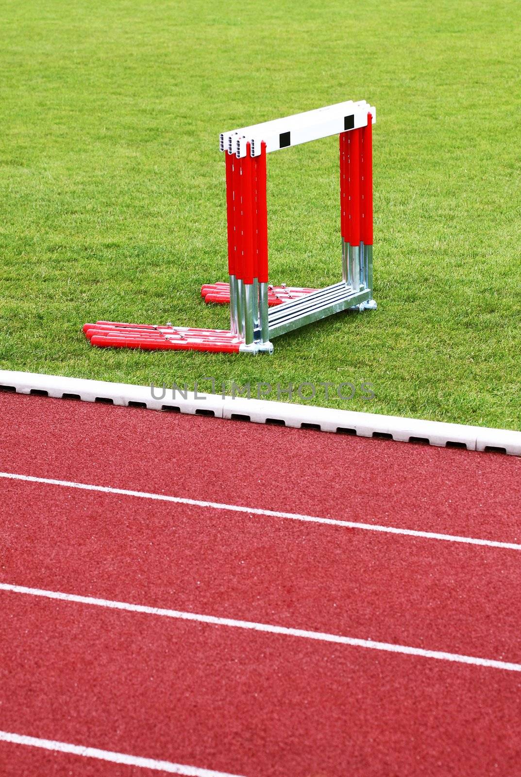 Track and hurdles on the green lawn