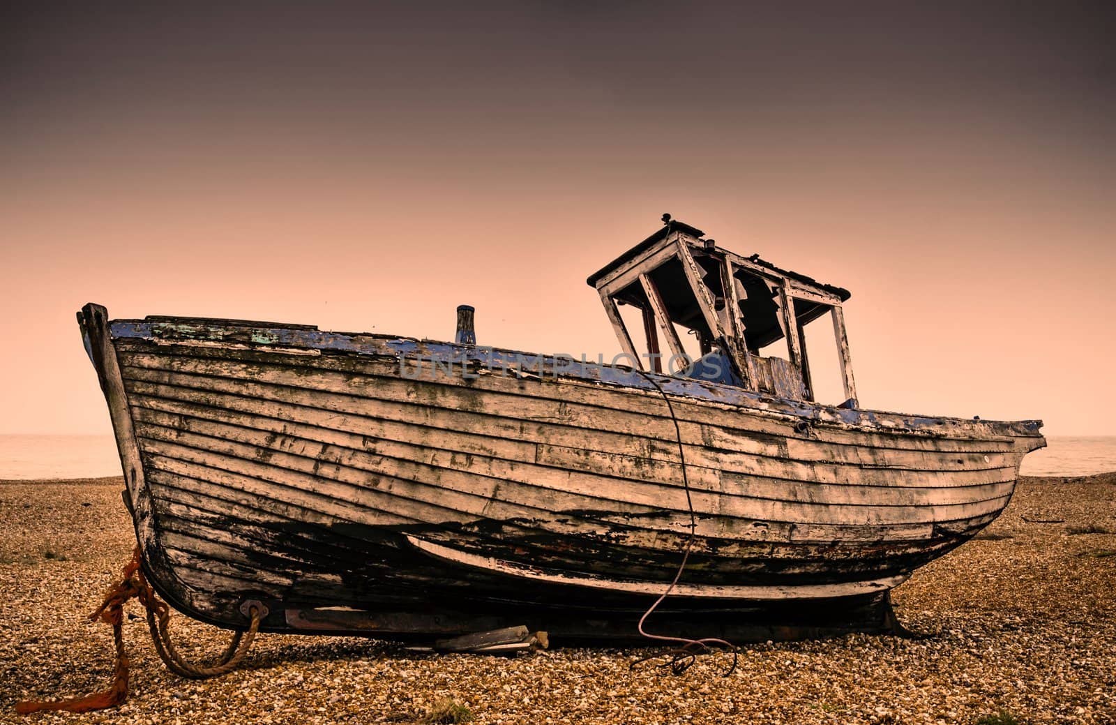 Old fishing boat abandoned on the beach