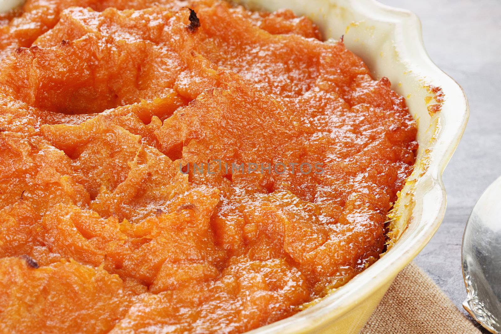 Sweet potato casserole. Extreme shallow depth of field with selective focus on center on potatoes. 
