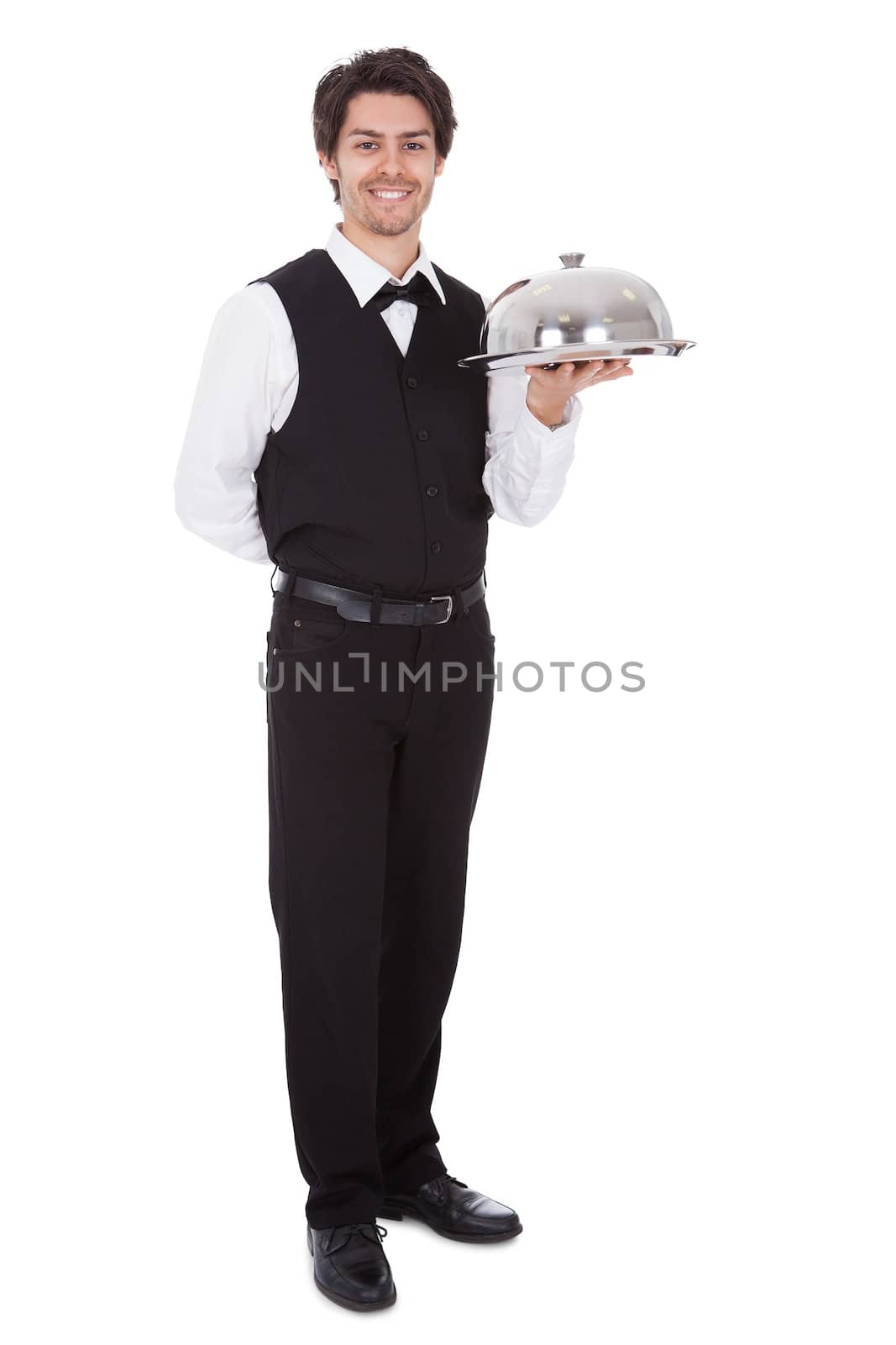 Portrait of a butler with bow tie and tray. Isolated on white