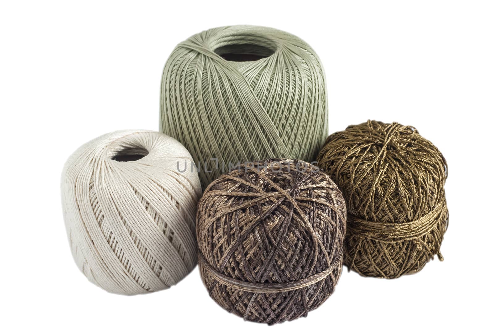Four skeins of yarn for knitting isolated on white background