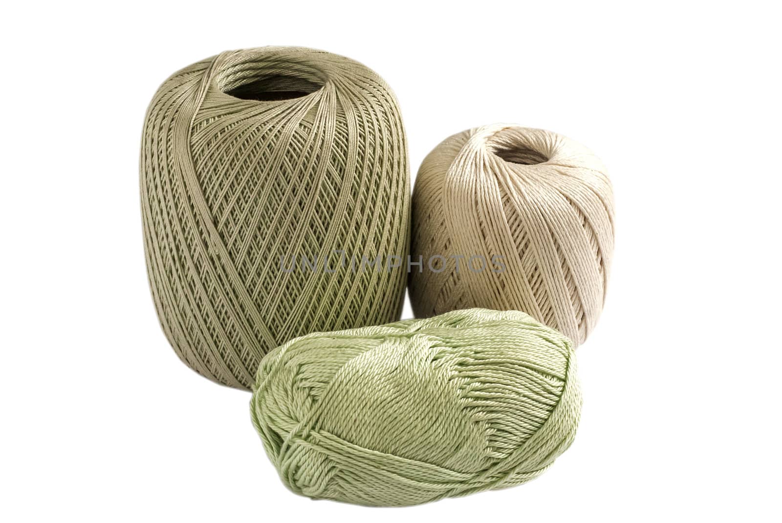 Three skeins of yarn for knitting isolated on white background