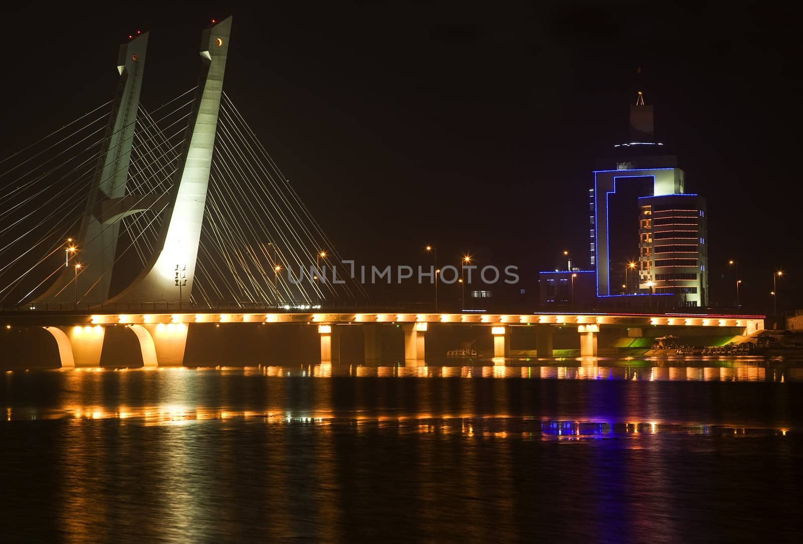 Tianhu Bridge, Hun River, Fushun, Shenyang, Liaoning Province, China Night Lights Rural Electricity Trademarks removed

Resubmit--In response to comments from reviewer have further processed image to reduce noise, sharpen focuse and adjust lighting.
