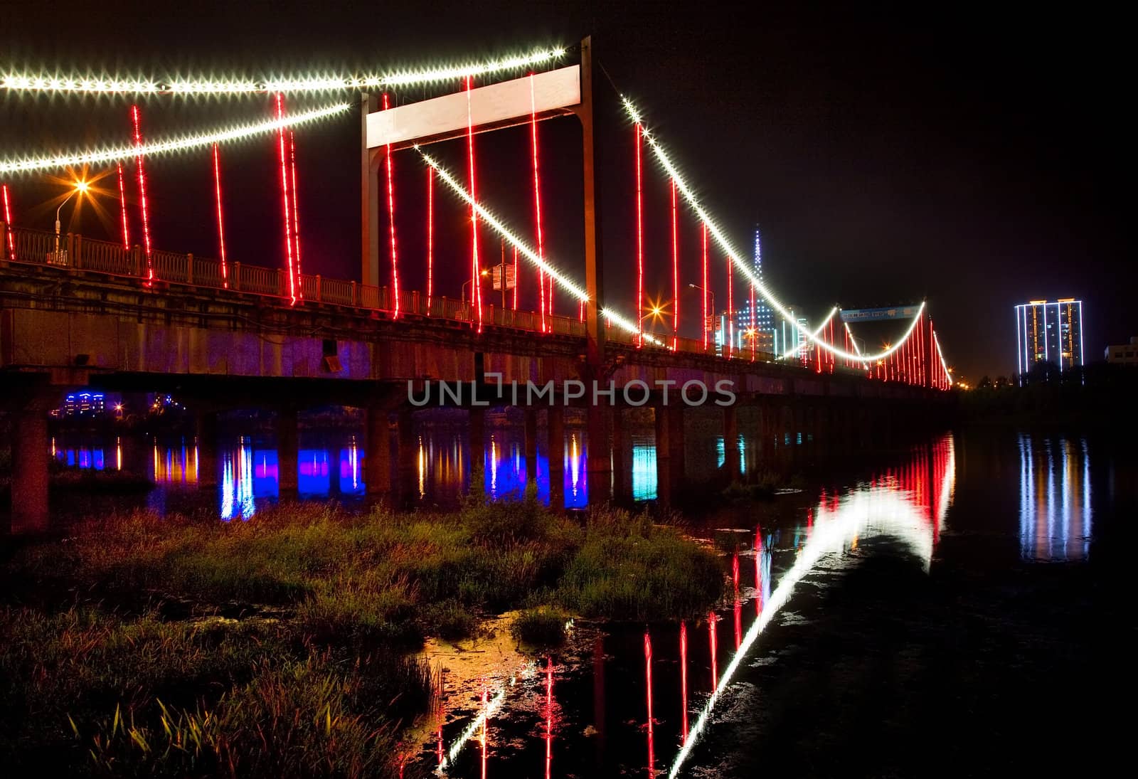 Red Lights Jiangqun Qiao, General Bridge, at Night, Crossing Hun River, Fushun City, Liaoning Province, China Electricity in rural China.