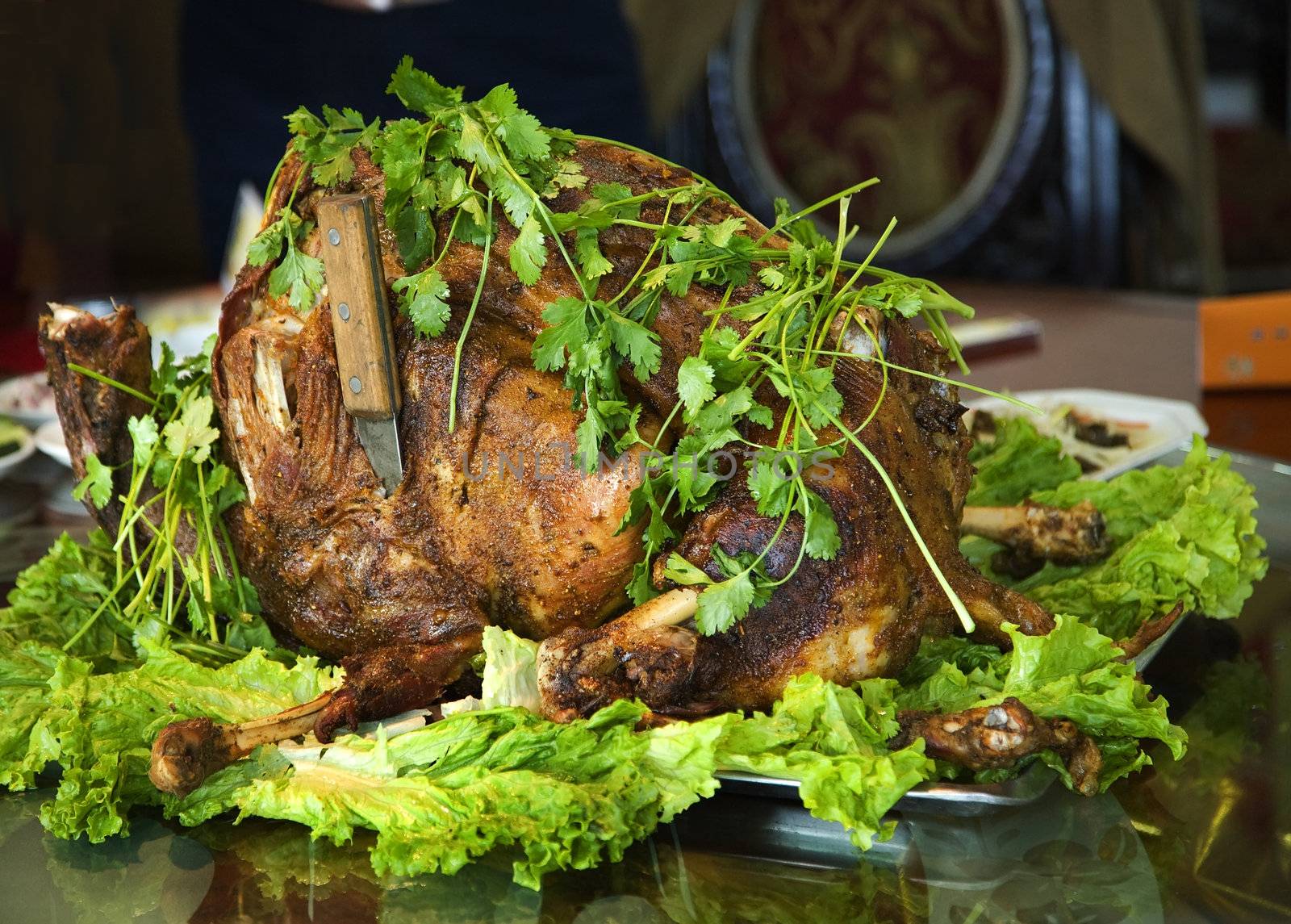 Roasted Whole Lamb with herbs and knife, Lanzhou, Gansu Province, China Uighur Moslem Area

Resubmit--In response to comments from reviewer have further processed image to reduce noise, sharpen focus, and adjust lighting.