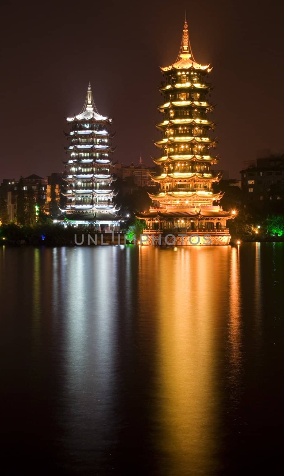 Sun, gold, and Moon, silver, Pagodas, Guilin, Guangxi, China at Night with Reflection