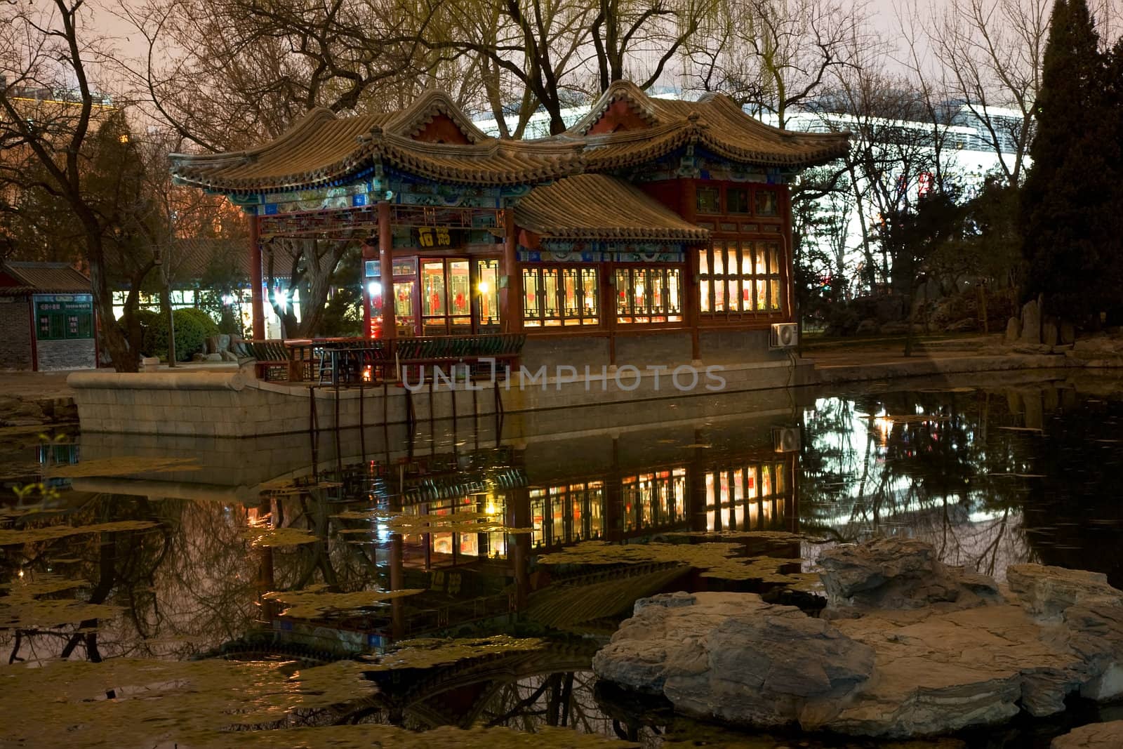 Stone Boat Temple of Sun, Beijing China, Pond, Reflection, Evening, Night Shot

Resubmit--In response to comments from reviewer have further processed image to reduce noise, sharpen focus and increase color.