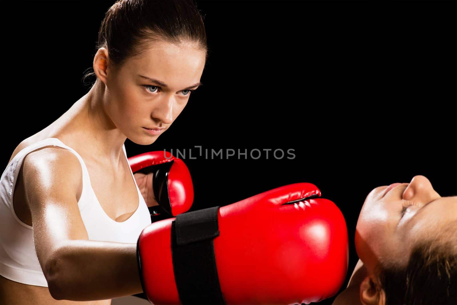 Aggressive boxing woman, hits an opponent in the head