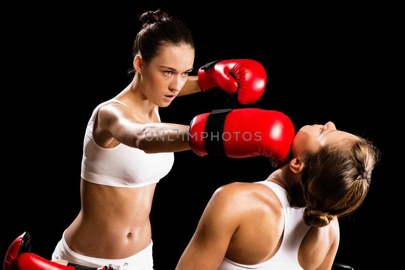 Aggressive boxing woman, hits an opponent in the head