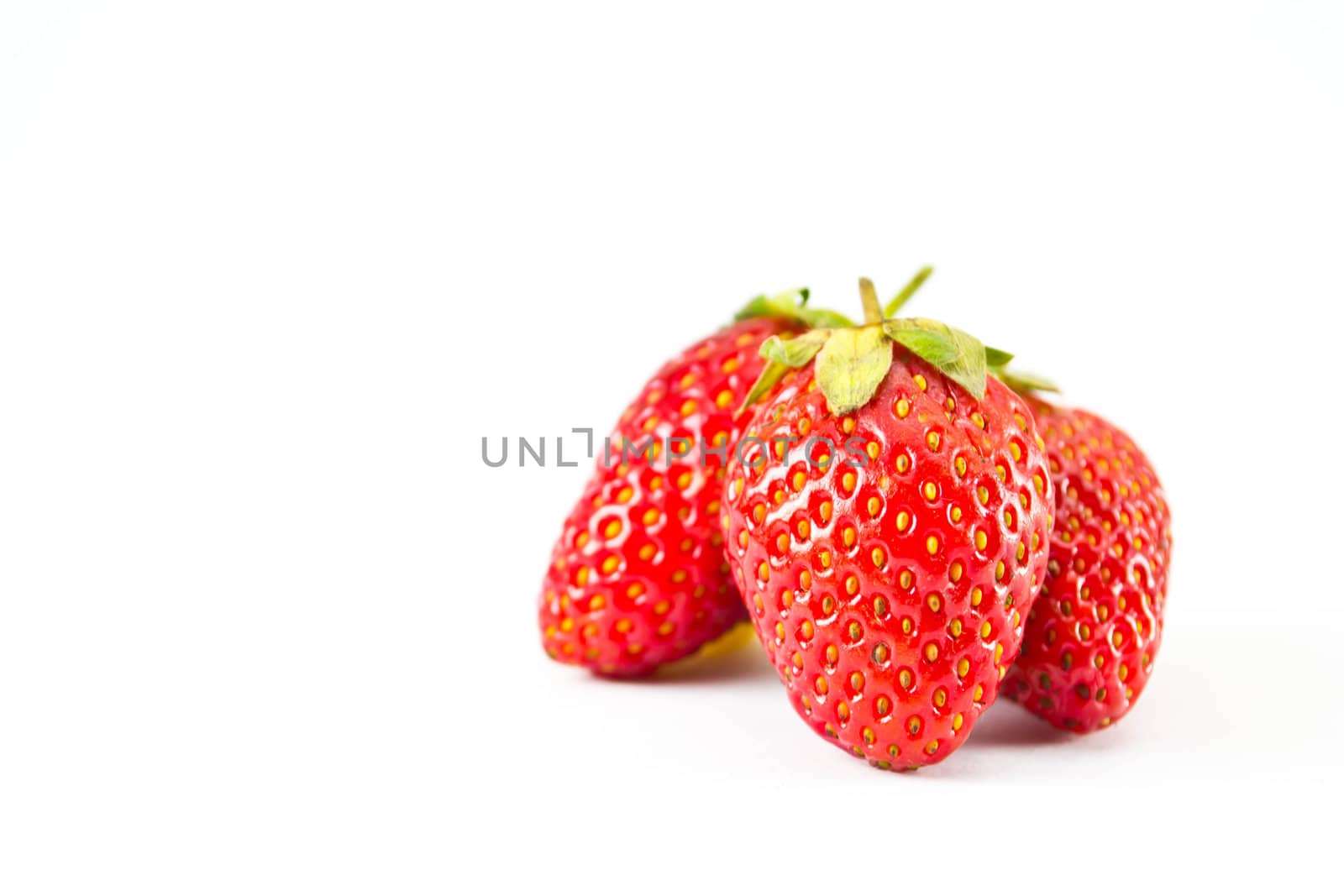 strawberries placed on a white background