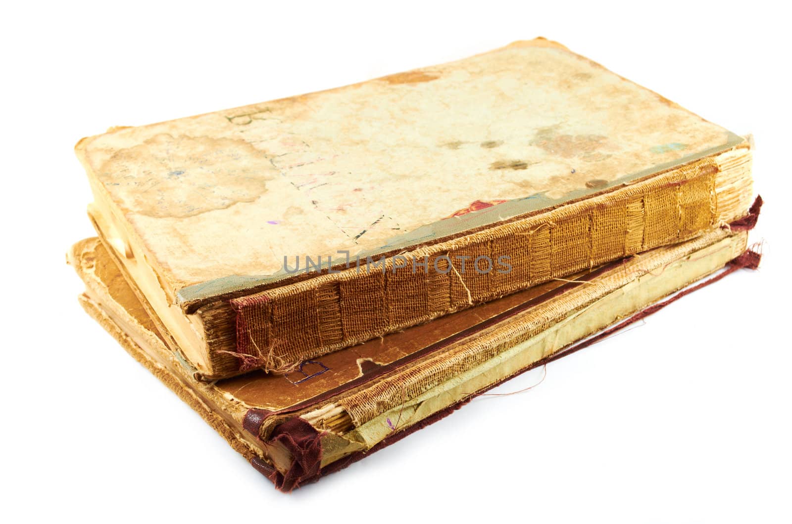 Old battered books on a white background