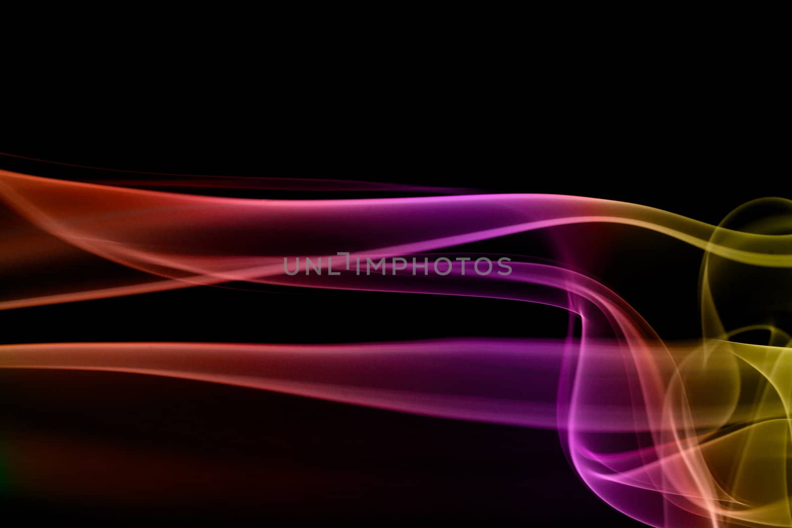 Multicolored smoke in black background