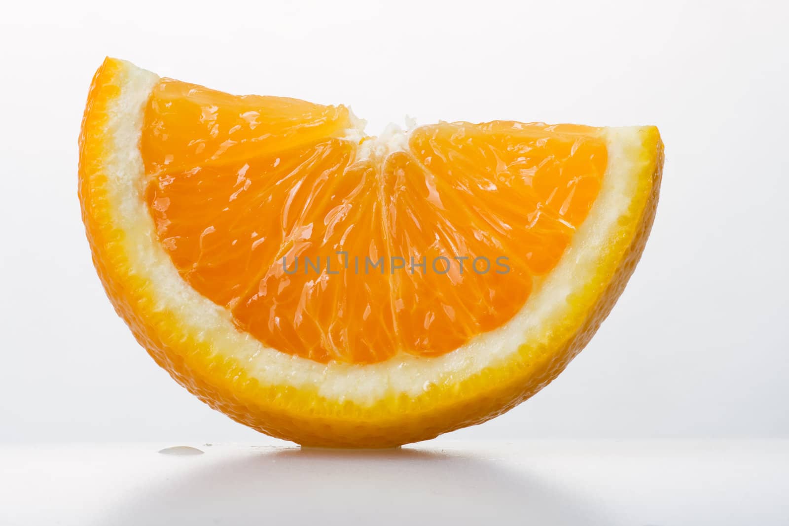 Sliced juicy orange on white background