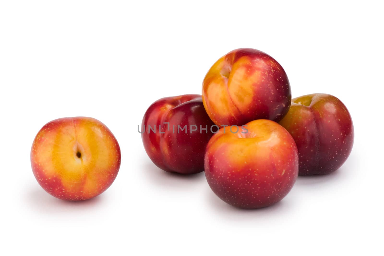 Group of plums isolated on white background