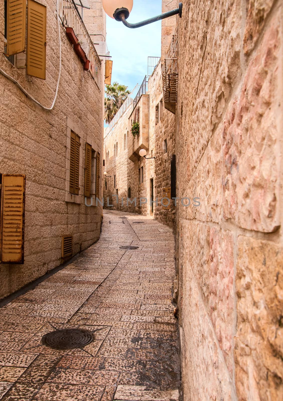 An alley in the old city in Jerusalem. by Zhukow