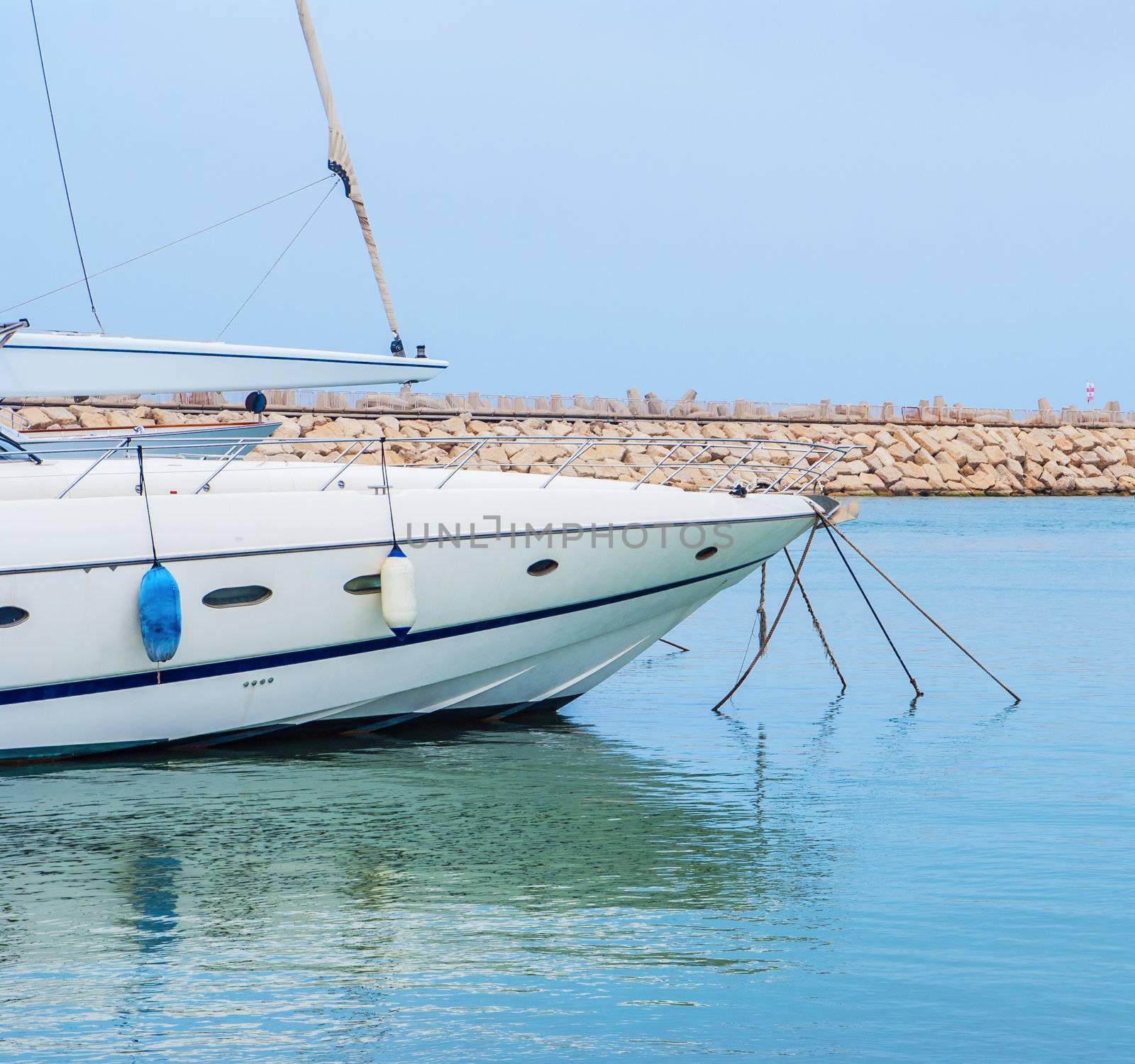 yacht in the harbor standing on an anchor