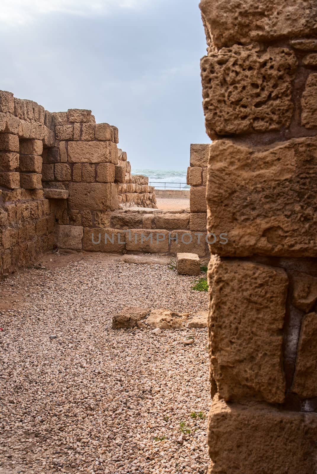 Ruins of the ancient Romanian harbor, Caesarea, Israel .