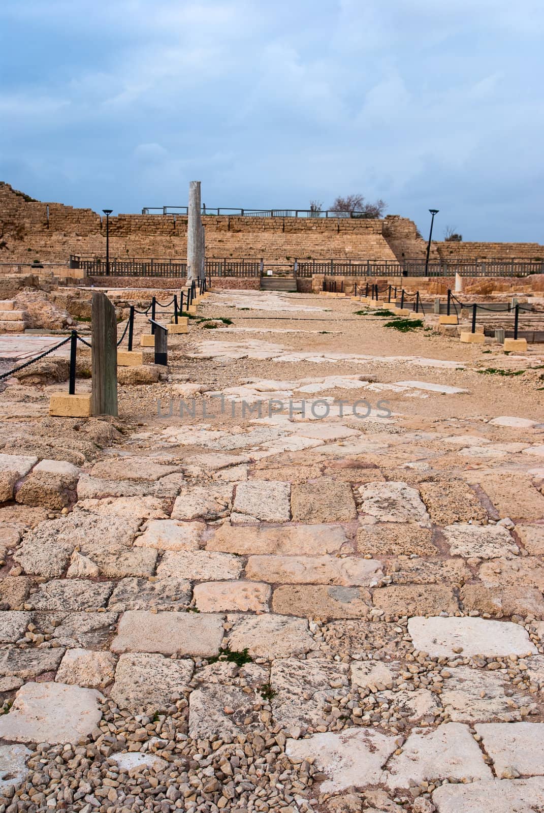 Ruins of the ancient Romanian harbor, Caesarea, Israel . by Zhukow