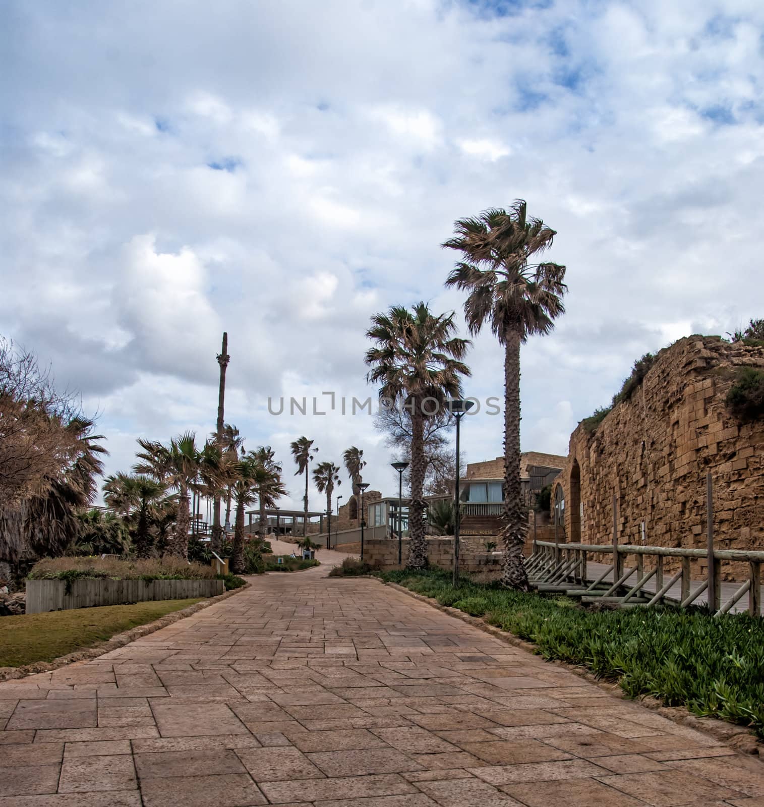 Ruins of the ancient Romanian harbor, Caesarea, Israel . by Zhukow