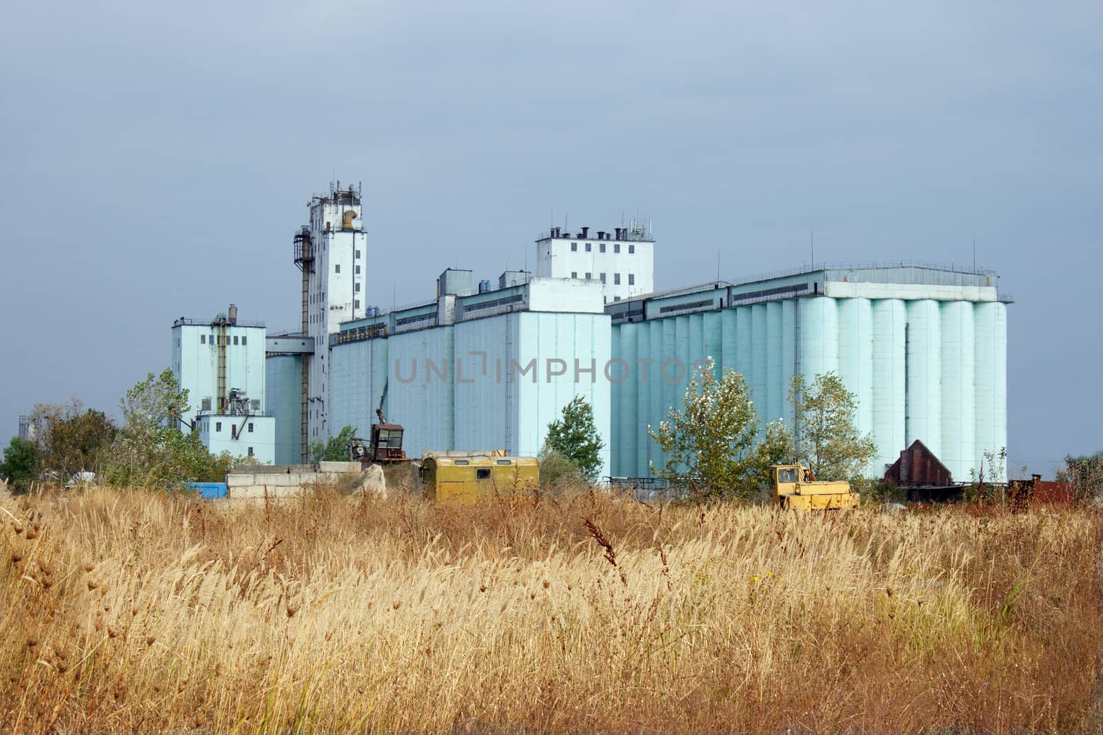 Large grain elevator rises among the steppe